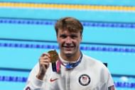 Robert Finke poses with his gold medal at the 2020 Tokyo Olympics. (Photo by Xavier Laine/Getty Images)